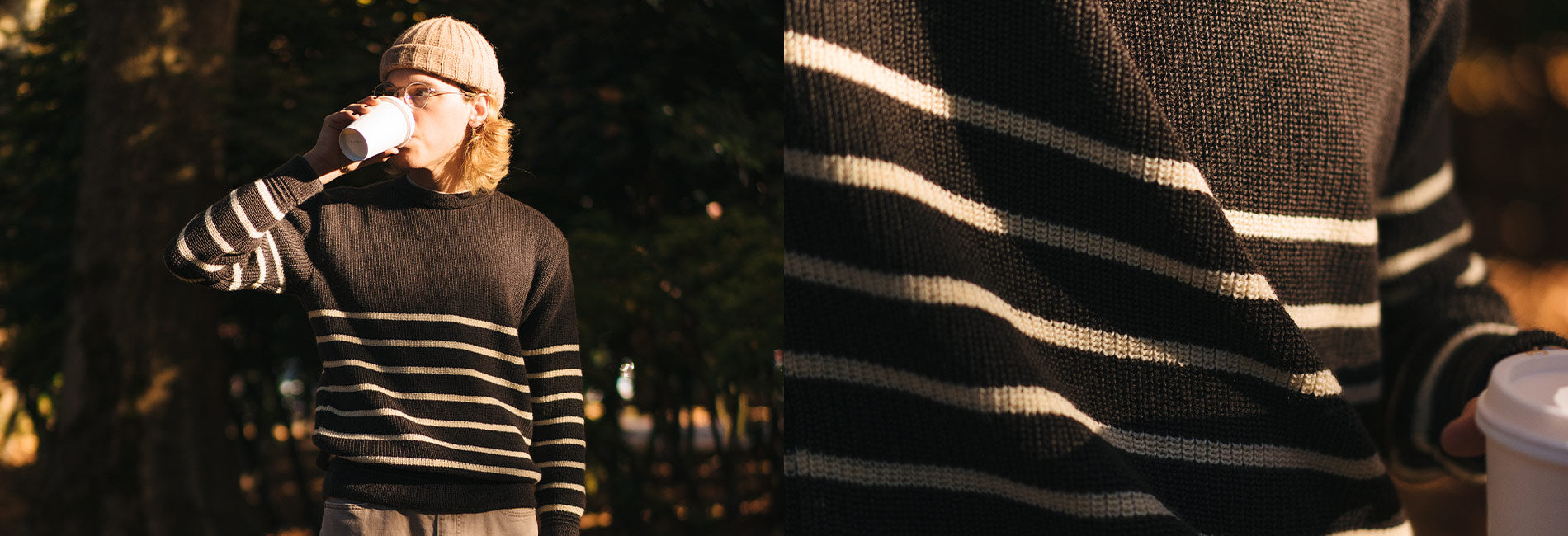 Cozy black and cream striped sweater, beanie, and coffee in golden park light — Heimat collection warmth.