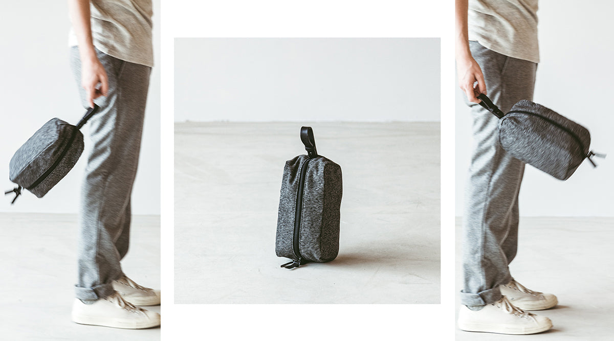 Three-panel image: person holding gray textured toiletry bag with black zipper and handle, shown from side, front, and angled views on light floor.