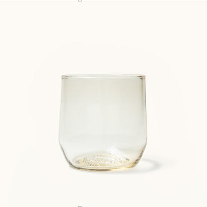 Light amber cocktail glass with a distinctive textured base.
