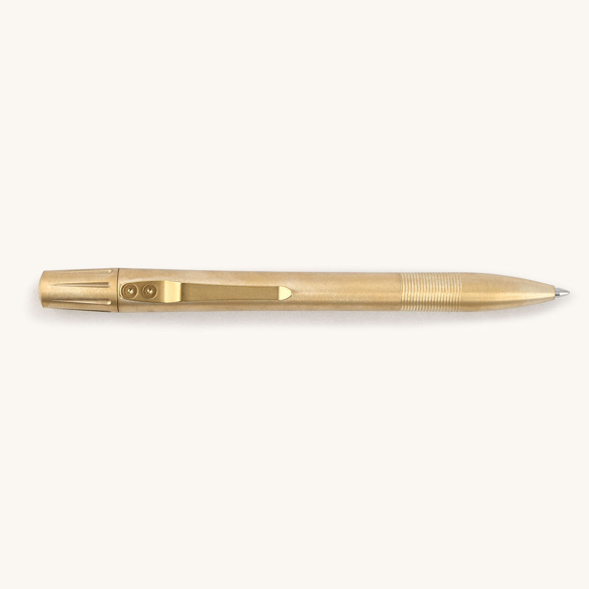 Brushed brass pen with a ribbed grip and a pocket clip secured by two visible screws.