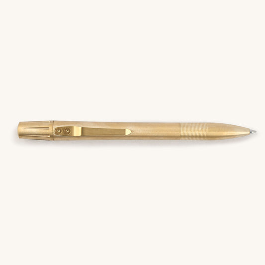 Brushed brass pen with a ribbed grip and a pocket clip secured by two visible screws.