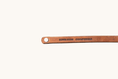 Tanner Goods and Made in the USA monograms on underside of leather wristband.