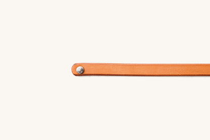 Saddle Tan Double Wrap Wristband featuring a silver rivet on its rounded leather end.